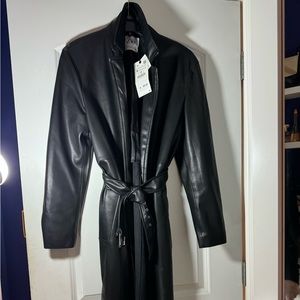 A faux leather black trench coat